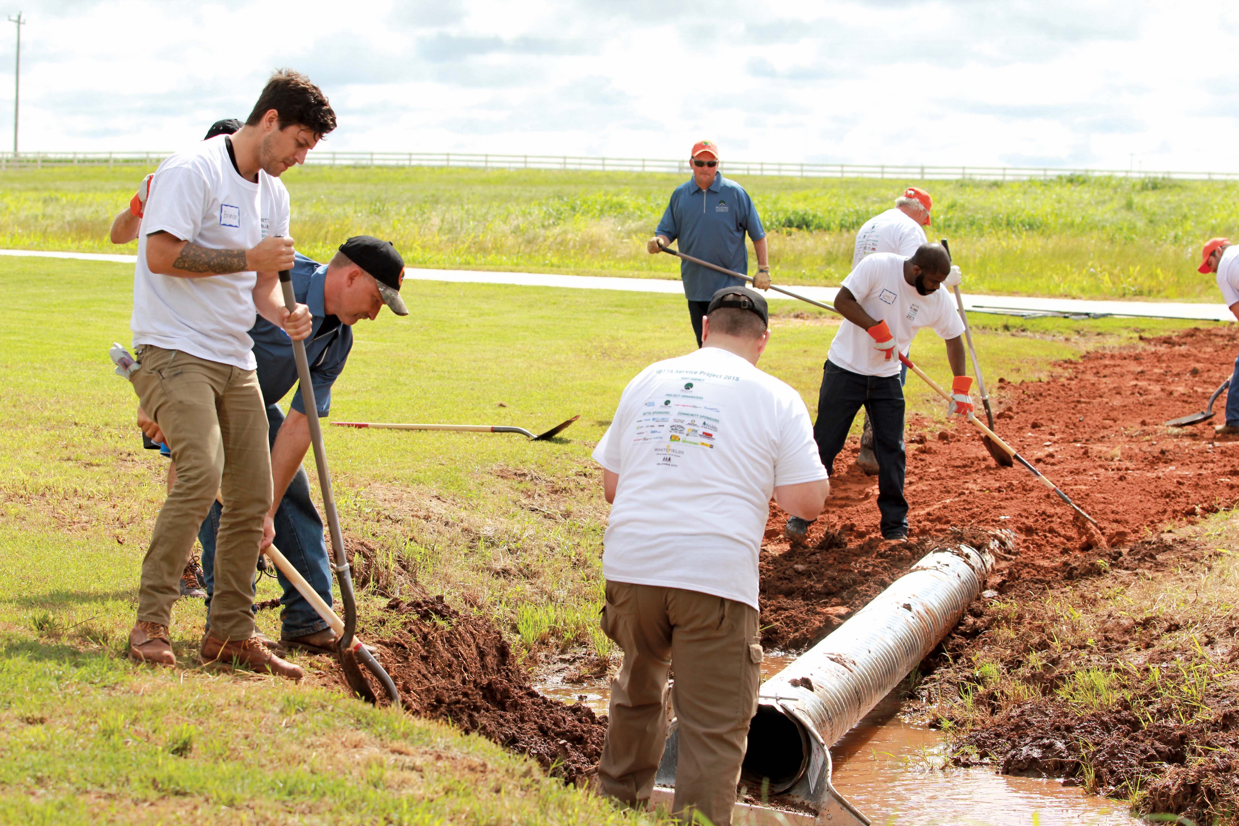 IBTTA Volunteer day hazardous site to a playing field