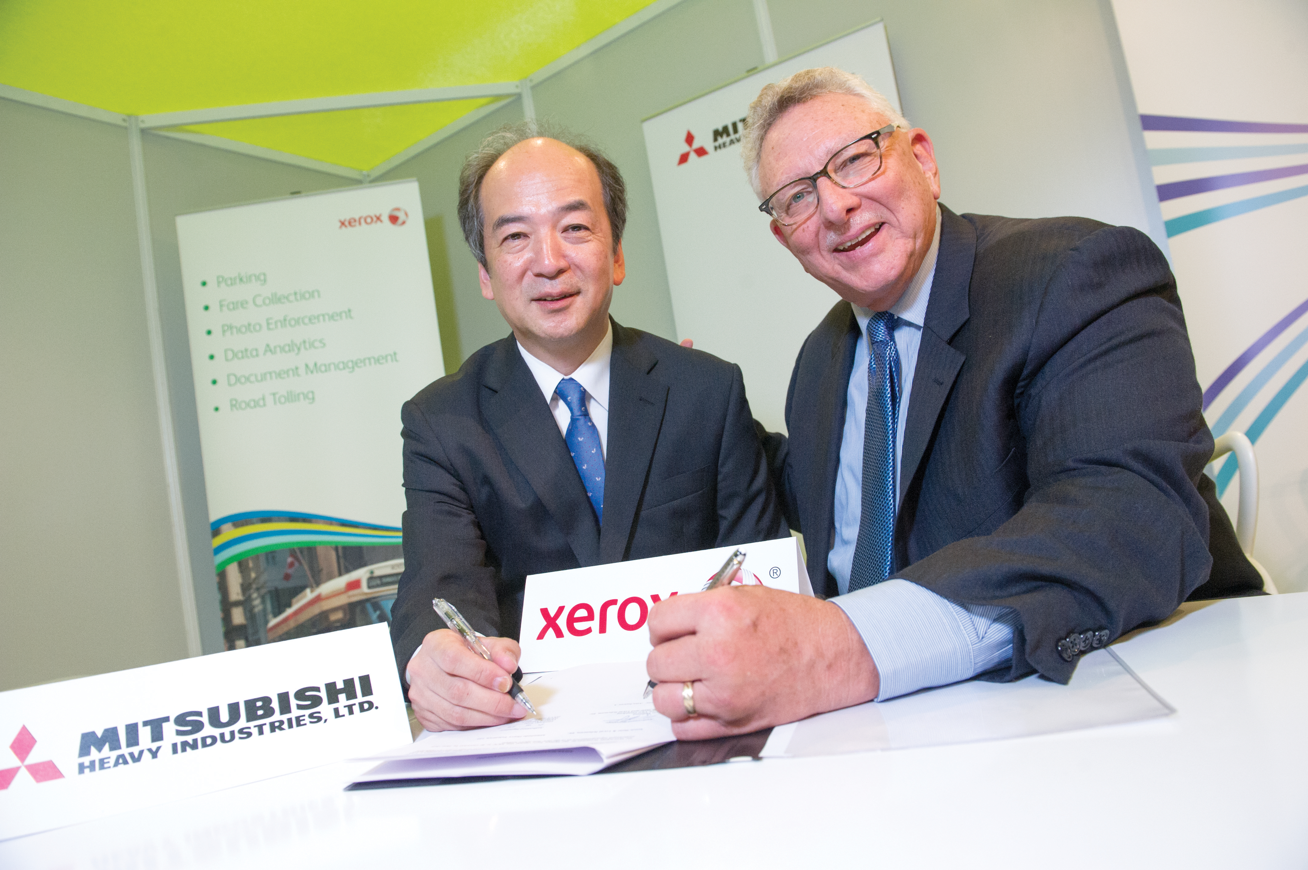 Hiroyuki Toda of Mitsubishi and Ken Philmus of Xerox ITS WC 15 Day 3 Xerox and Mitsubishi come together