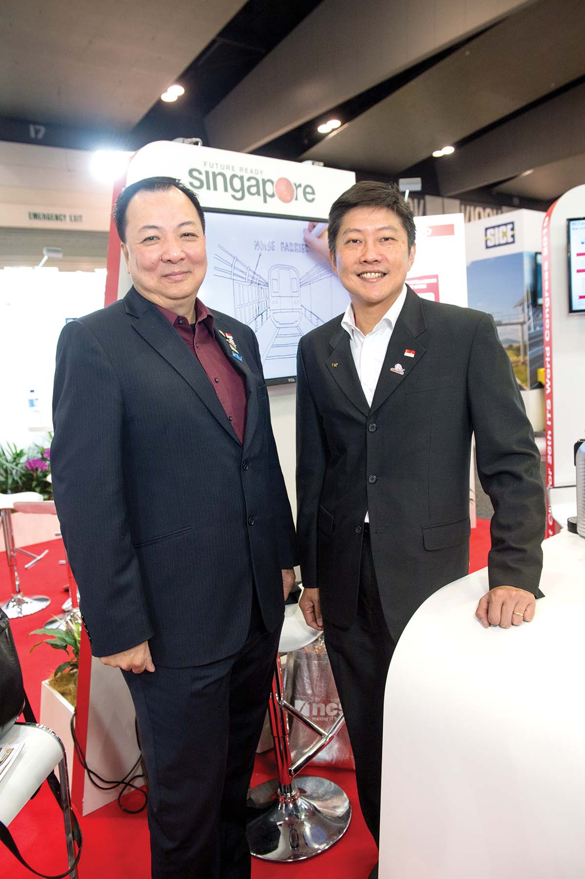 Andrew Chow (left) and NG Chee Meng on the ITS Singapore stand ITS WC 2016 Day 2 p6 Andrew Chow & NG Chee Meng ITS Singapore