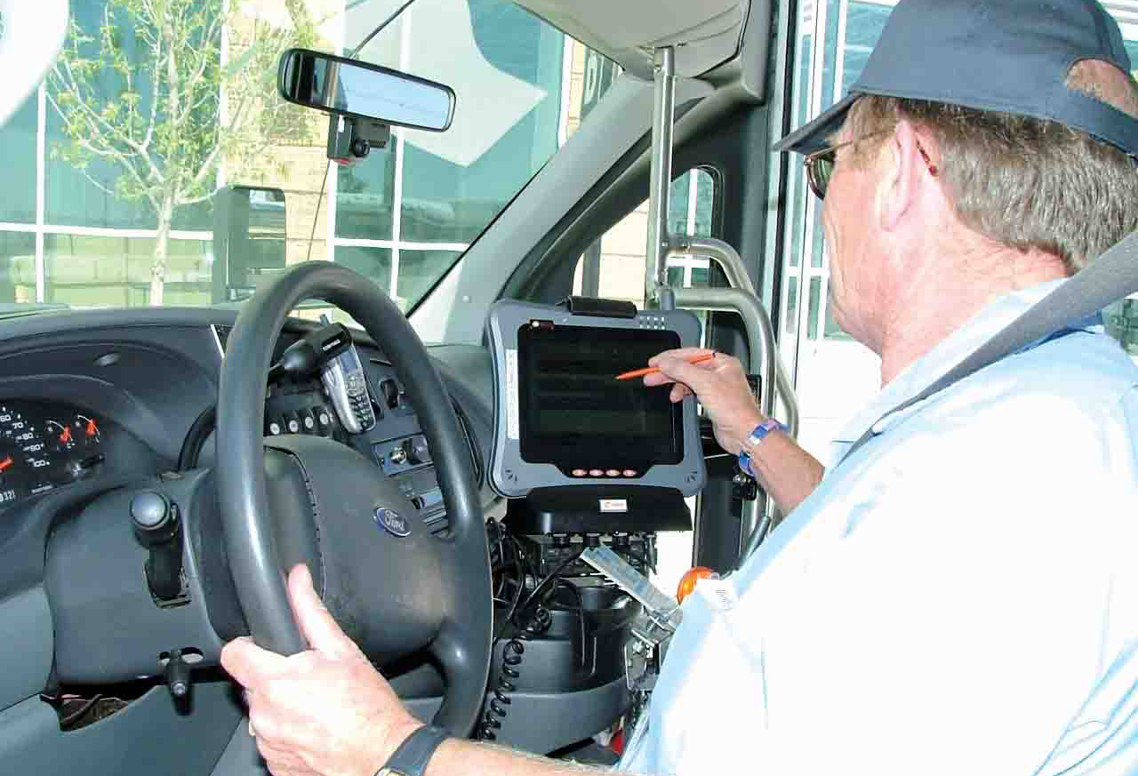 CnR driver with tablet at a stop