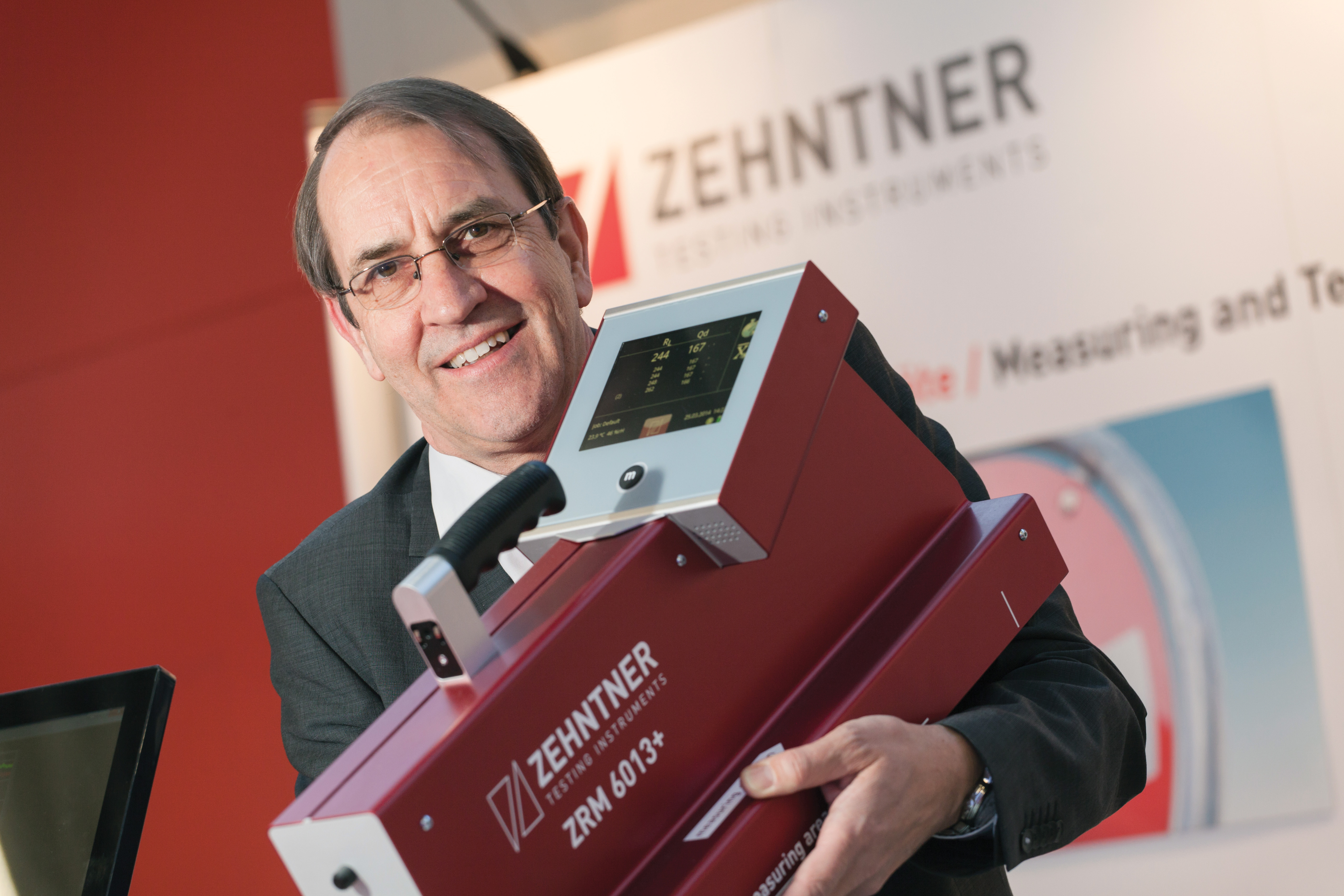 Peter Zehnter showing Zehnters's new handheld tester for roadmarkings ZRM6013+ Peter Zehnter Zehnter