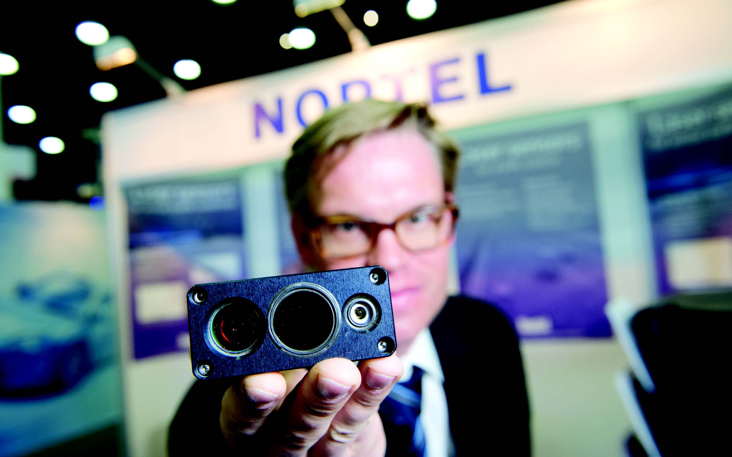 Jukka Pahkala of Noptel displays the laser radars Jukka Pahkala of Noptel displays the laser radars