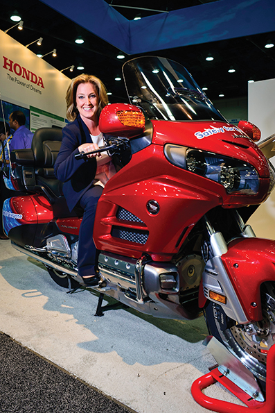 Bobbie Kowalskie test rides the motorcycle simulator Honda Bobbi Kowalske