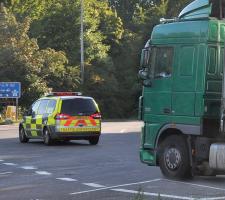 Vehicles identified for weighing and inspection are diverted by VOSA officers in marked cars