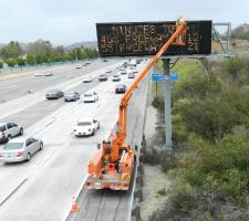 staff attending a variable message sign