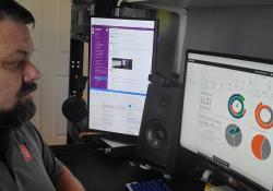 Jason Hildreth, Q-Free senior traffic signal technician, prepares for the Greeley installation by first setting up system configurations and controller software database templates