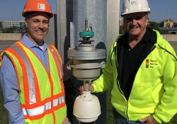 Ryan Brown, president, Signal Service, (left), and Steve Dowdall, ITS director, Signal Service with the MG2 CAT6a Ethernet Camera Lowering Device and a Bosch Starlight IP camera