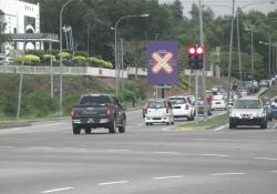 Cross sign on road